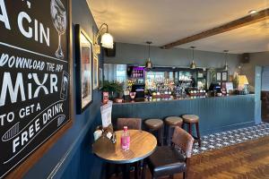 a bar with a table and chairs and a counter at The Lobster in Sheringham +37 photos