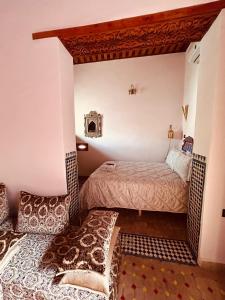 a bedroom with two beds in a room at Riaad Hamad in Fez