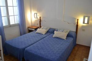 Postel nebo postele na pokoji v ubytování Apartamento Castellsol 105.