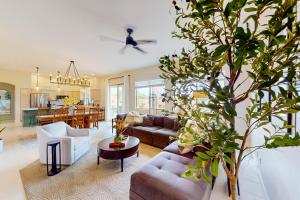 a living room with a couch and a table at Pink Mountain Retreat in Tucson