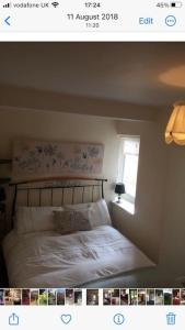 a picture of a bedroom with a bed with a window at The Old Smithy, Ullswater in Glenridding