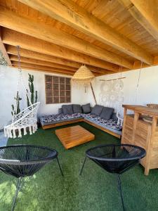 a living room with a couch and two chairs at Villa Mimaël in Saint-Aygulf