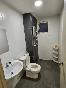 a small bathroom with a toilet and a sink at Charming Hideaway Room With Private Bathroom Near Bukit Jalil Stadium, Pavillion Bukit Jalil, APU in Kuala Lumpur