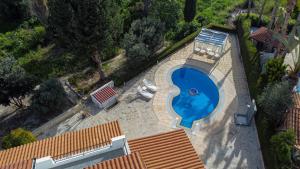 an overhead view of a swimming pool in a house at Grand Villa Baci in Coral Bay