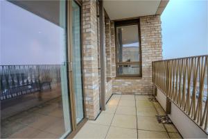 a balcony of a building with a window at 2 Bedroom Flat near Stanmore Station in Stanmore