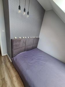 Een bed of bedden in een kamer bij Apartament Bilitewskiego