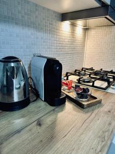 a microwave and a toaster on a kitchen counter at Apartament Natymar2 in Adjud