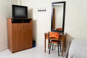 TV a/nebo společenská místnost v ubytování Hotel Juanambu