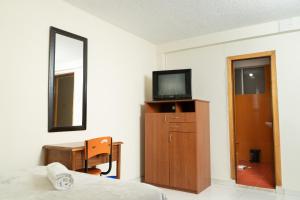 TV a/nebo společenská místnost v ubytování Hotel Juanambu