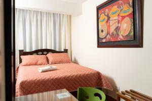 Postel nebo postele na pokoji v ubytování Hotel Juanambu
