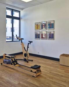 a room with a gym with a exercise bike at New Hotel of Marseille - Vieux Port in Marseille
