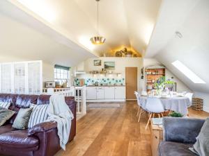 a living room with a couch and a table at 3 Bed in Southerndown 57715 in Southerndown