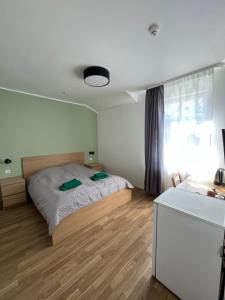 Postel nebo postele na pokoji v ubytování Elīna