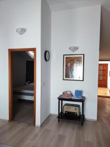a room with a bed and a table with a mirror at Apartment Nika in Umag