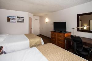 Postel nebo postele na pokoji v ubytování Travelodge by Wyndham Fort Wayne North