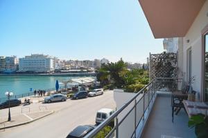 a balcony of a building with a view of a street at OpenSea in Chalkida