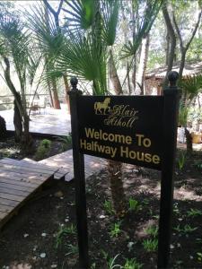 a sign for a welcome to halley house at Lanseria Country Estate in Lanseria