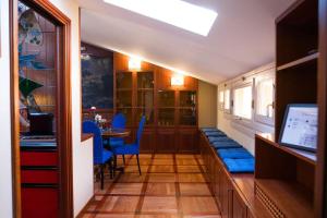 a dining room with blue chairs and a table at Carbonesi Luxury - Centro storico in Bologna