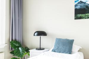 Ένα ή περισσότερα κρεβάτια σε δωμάτιο στο Iðunn Apartments by Heimaleiga