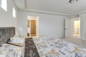 a white bedroom with a large bed in a room at Spacious Denver Vacation Home about 18 Mi to Downtown! in Aurora