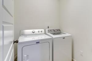 a white washer and dryer in a small room at Spacious Denver Vacation Home about 18 Mi to Downtown! in Aurora