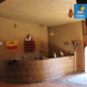a bathroom with two sinks and a counter top at Hostel la palmeraie merzouga in Merzouga