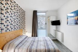 Ένα ή περισσότερα κρεβάτια σε δωμάτιο στο Alpen Pila Residence Loft 7