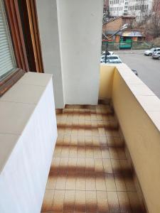 an empty balcony with a view of a street at Rila Apartment in Samokov