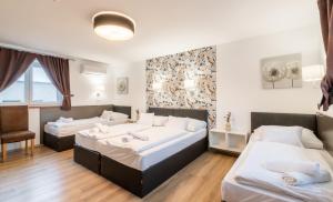 Posteľ alebo postele v izbe v ubytovaní Autohof 171 Hotel Hegyeshalom