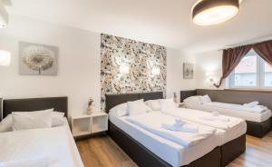 Posteľ alebo postele v izbe v ubytovaní Autohof 171 Hotel Hegyeshalom