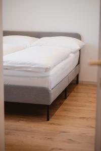 Postel nebo postele na pokoji v ubytování Kalkalpen Apartments