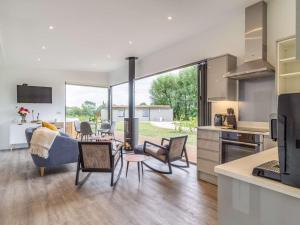a kitchen and living room with a table and chairs at 2 Bed in East Bergholt 82397 in East Bergholt