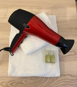 a red stapler on top of a white towel at Historic Centre Apartments VIII in Prague