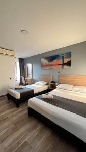 Postel nebo postele na pokoji v ubytování Hotel Gran Conquistador 33