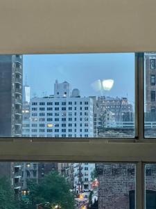 a view of a city skyline from a window at 2 bedrooms Chelsea apartment - Manhattan in New York