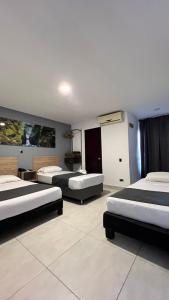 Cama o camas de una habitación en Hotel Gran Conquistador 33
