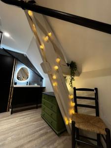 a room with a staircase with lights on it at Le Chalet Chic, Cosy avec Sauna au Centre Ville in Troyes