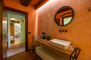 a bathroom with a sink and a mirror on the wall at Villa Carlotte - quiet and comfort in Pastrengo