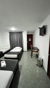 Postel nebo postele na pokoji v ubytování Hotel Gran Conquistador 33
