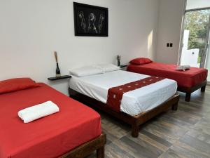 Postel nebo postele na pokoji v ubytování Villas Carlota Cancún