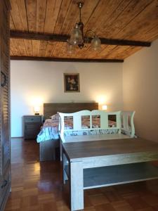 a bedroom with a bed and a wooden ceiling at Apartma Brina 3 in Sežana