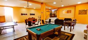 a living room with a pool table in it at HGA-Coral-Spa in La Paz