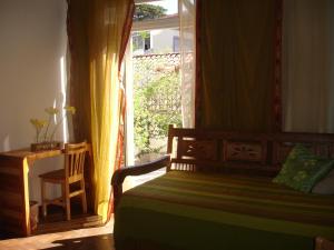 Cama ou camas em um quarto em Zen Hotel Brasil