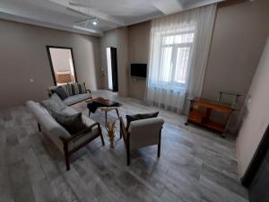 a living room with a couch and a table at Lux in Gyumri