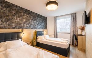 Posteľ alebo postele v izbe v ubytovaní Autohof 171 Hotel Hegyeshalom