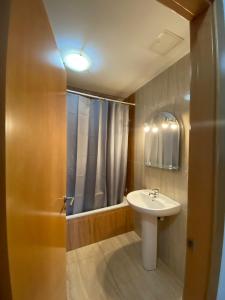 a bathroom with a sink and a shower at Apartamento Sant Blai in Tivissa