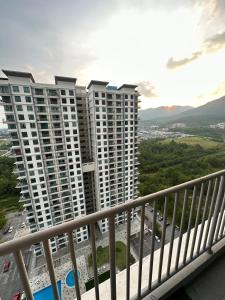 a view of tall apartment buildings from a balcony at Blossom - Casa Kayangan Meru Ipoh by GOSWELL in Ipoh