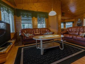 a living room with leather couches and a coffee table at Holiday Home Pepi by Interhome 