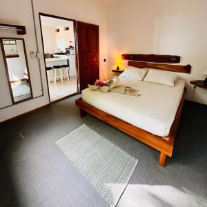 Кровать или кровати в номере Beach Front Bahia