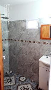 a bathroom with a shower and a sink at LUSANYUN 1 in Villa Independencia
